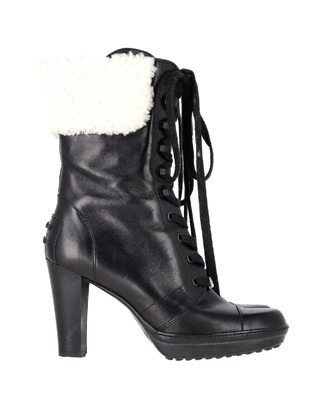 Unleash Your Trendy Side Tod's Shearling Lace-Up Heeled Boots in Black Leather
